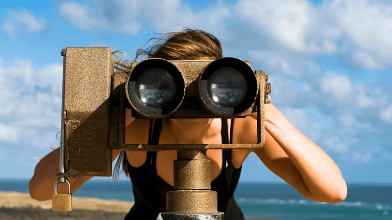 Girl looking through binoculars