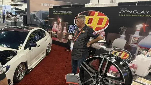 PDP tradeshow booth at SEMA showcasing automotive detailing products and branding